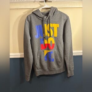 Unisex Nike Gray Hoodie with Bold Multicolor Print